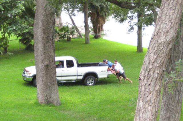 Giving the truck/ambulance a push to get it headed back up the hill