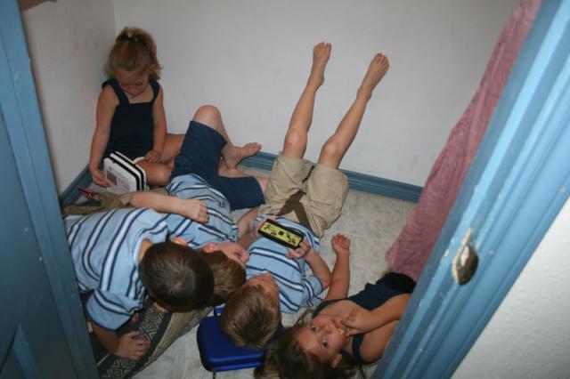Kids playing in a closet
